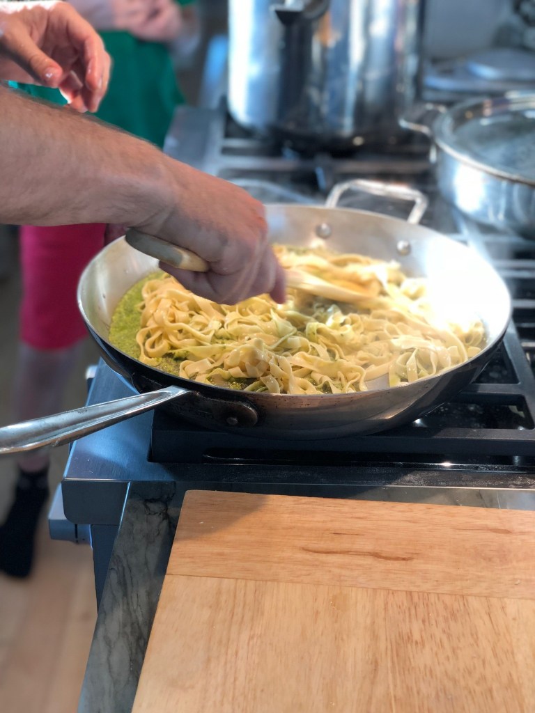 Tossing pesto pasta