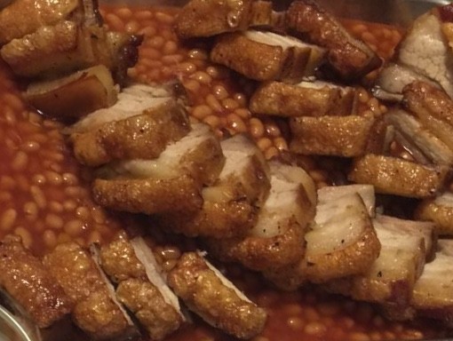 Crispy pork belly with beans